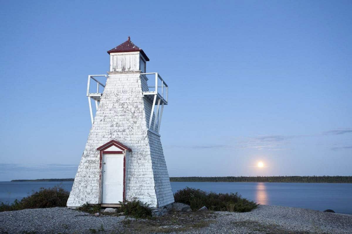 Lighthouse in Hecla, Manitoba with the sun setting behind it