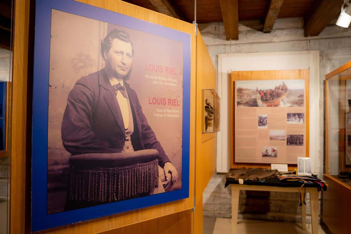 Museum exhibit with a large photo of Louis Riel