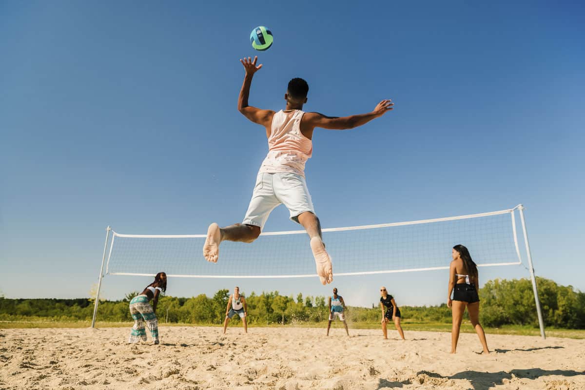 A beach volleyball player on the beach at Birds Hill Park