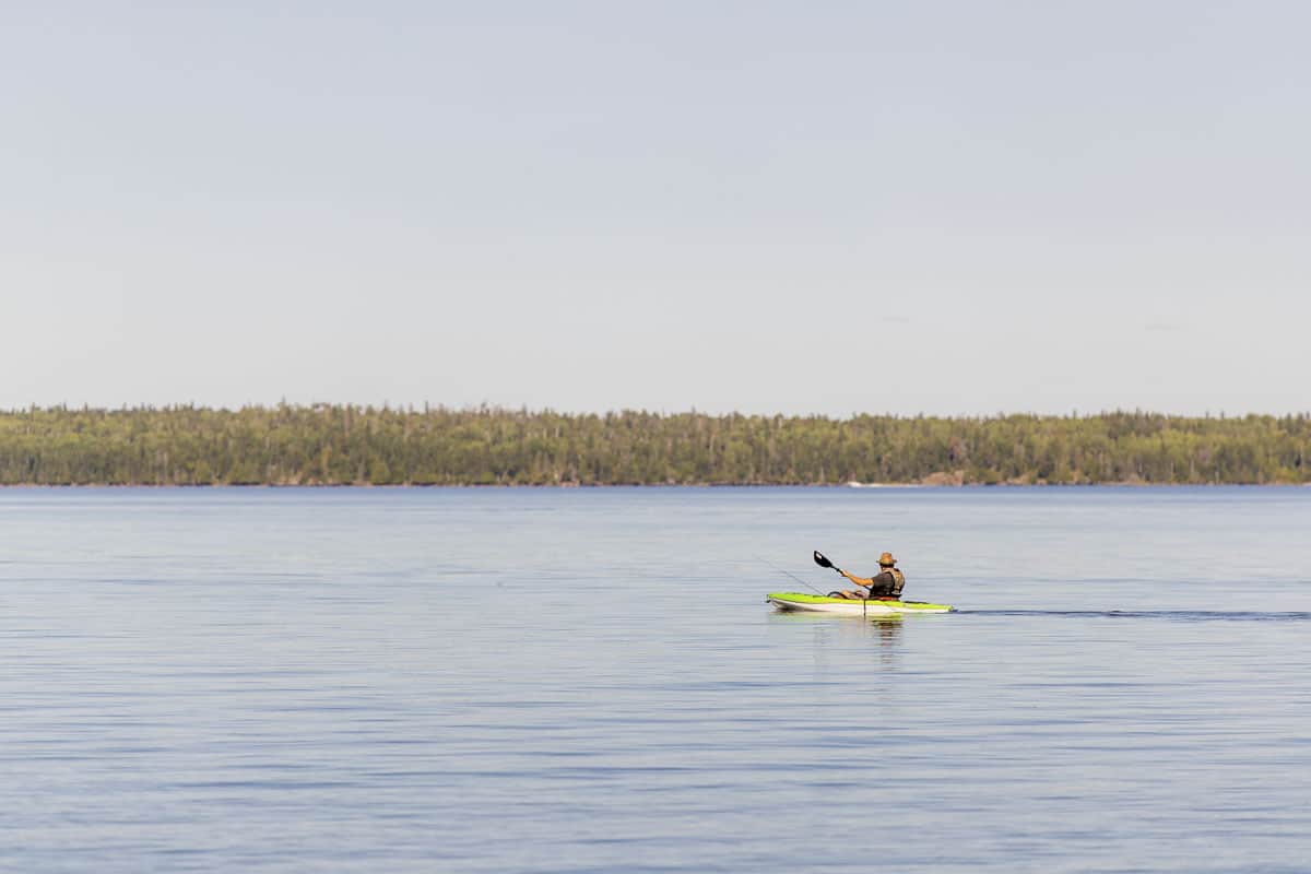 A kayaker in West Hawk Lake