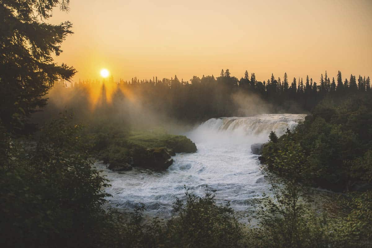 The sun sets over Pisew Falls.