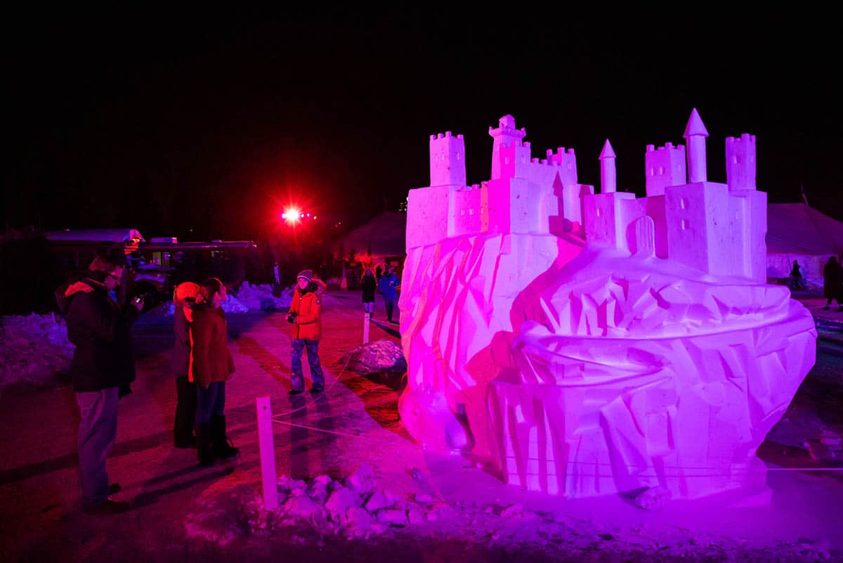 Festival du Voyageur sculpture at night