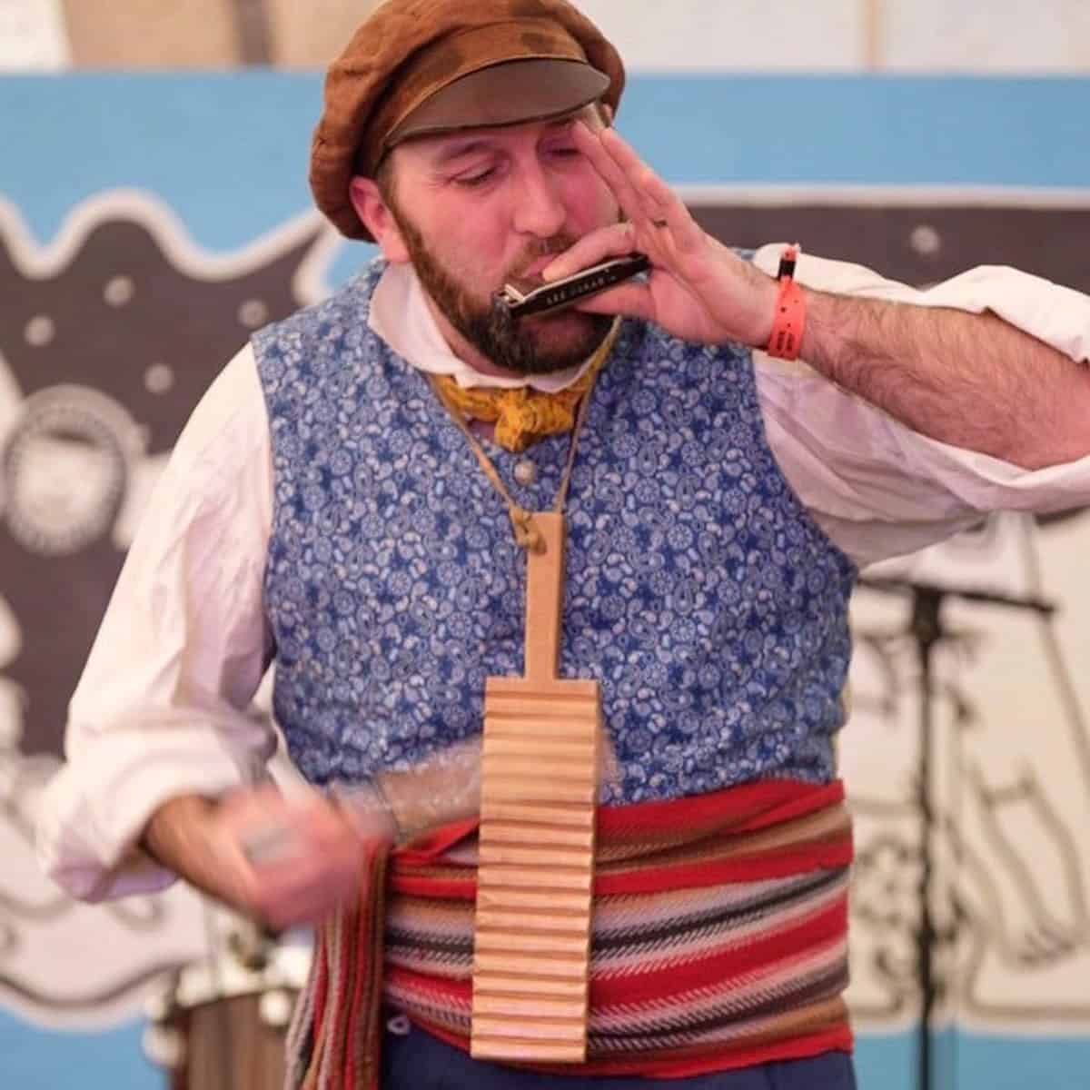 Musician plays a harmonica